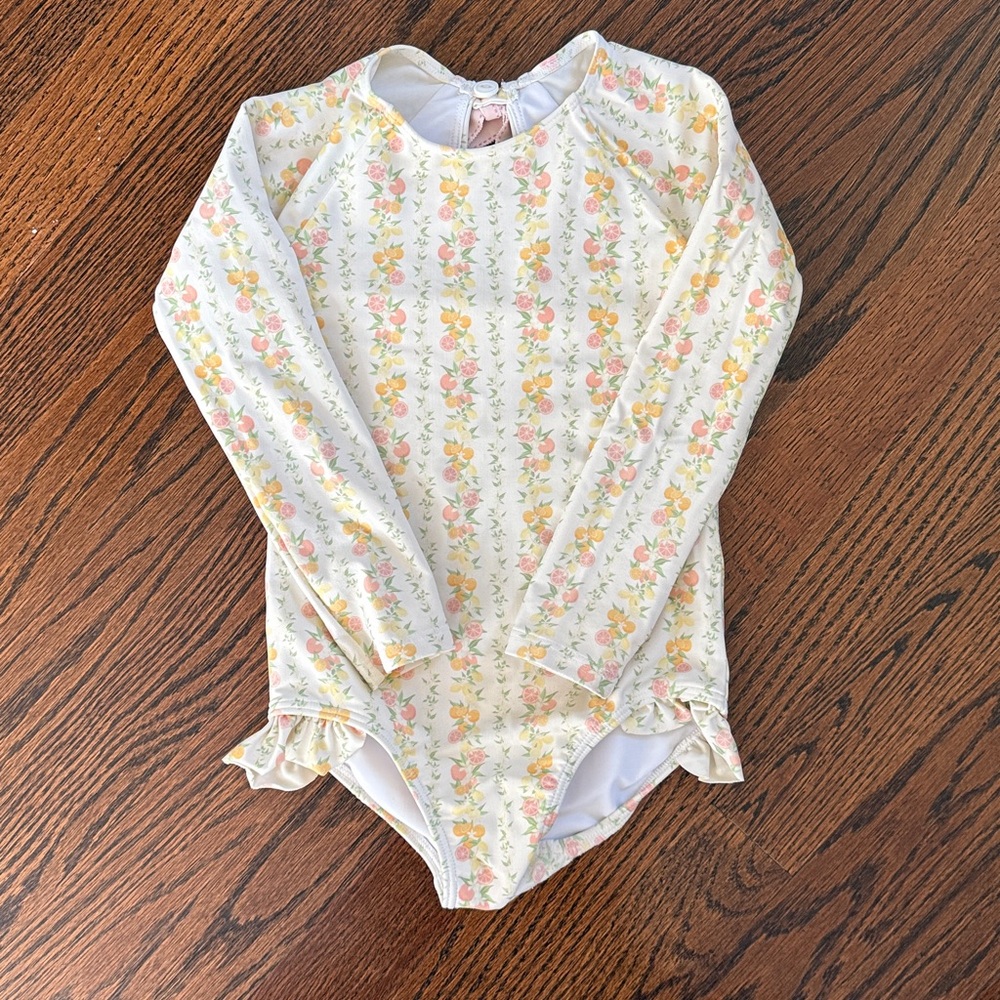minnow girls rashguard one piece swimsuit in linear citrus.